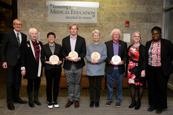 from left to right: Dean Page; Gov. Kunin; Dr. Faricy; Dr. Herrington; Dr. Leonard; Professor Emeritus William Pendlebury, M.D. (on behalf of his wife, Dr. Cushman); Dr. Dougherty; Margaret Tandoh, M.D., Associate Dean for Diversity and Inclusion