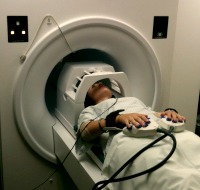 Person with head in MRI simulation machine