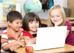 KidsWorkingonComputer250x180_001 Children in school with laptop