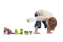 VCHIPHomePage-LittleBoyPlayingWithBlocks_000 Toddler boy playing with blocks