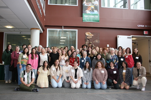 Group of people posing for the picture