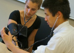 Students using a blood pressure cuff