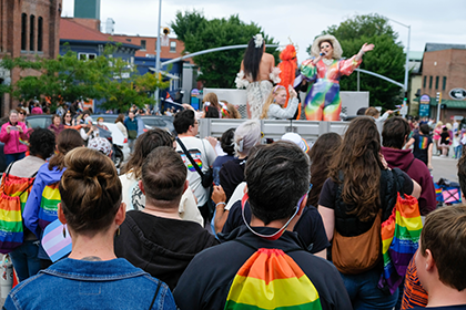 Pride Parade with Pride flags and people marching