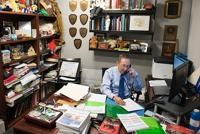 Dr. Lewis First in his office at the UVM Larner College of Medicine