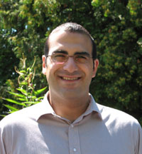Menalaos Symeonides, PhD smiling in headshot