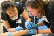 Residents working with a patient